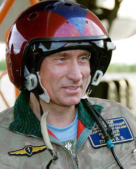 Russian President Vladimir Putin talks after arriving in Olenegorsk on board the Tupolev TU-160 strategic bomber Pavel Taran on Tuesday.  Putin flew in Russias most potent bomber and took part in the launch of cruise missile in the Arctic north, dusting off the military image he cultivated when he first came to power.