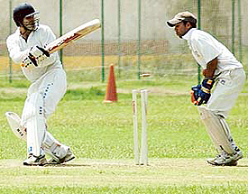 Deepak Saini of Panjab University campus being bowled by Aseem Gupta of S.D. College during an inter-college cricket tournament of Panjab University on Thursday.
