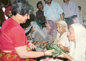 Ms Sneh Prabha, president of the Vajra Army Wives Welfare Association, honours war widows at a function organised in Jalandhar cantonment