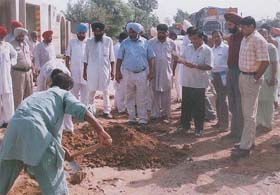 DC Rahul Bhandari inspects water and sewerage work at Mehraj village