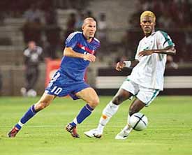 Zinedine Zidane of France challenges Romaric NDri of Ivory Coast during their friendly soccer match at the Mosson stadium in Montpellier on Wednesday