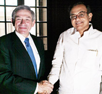 World Bank President Paul Wolfowitz (L) shakes hands with Union Minister for Finance P. Chidambaram during a meeting in New Delhi on Friday.