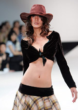 A model presents a creation by a Thai graduate designer during the Bangkok Fashion Week, 2005, in Bangkok on Friday. The event will end on Sunday.