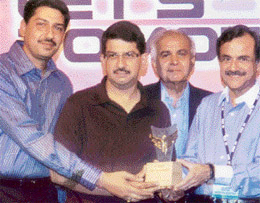 Mr Deepak Joshi, MD (second from left), and Mr Vikram Joshi, Director (left), of Joshi Autozone, receive the Platinum Award from Mr Jagdish Khattar, Managing Director, Maruti Udyog, at a ceremony held at Hilton Hotel in Paris.