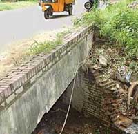 An open nullah on road dividing Sector 29 and 30.