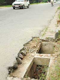 Open drains on road dividing Sector 7 and 8