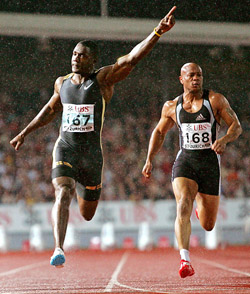 World champion Justin Gatlin of the USA celebrates on winning the mens 100 metres race at the Zurich Golden League meeting in Switzerland on Friday. Gatlin won in a time of 10.14 seconds while compatriot Maurice Greene (right) finished eighth. 