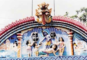Krishna, the Makhan Chor, with friends  Frieze on a doorway of a temple at Vrindavan