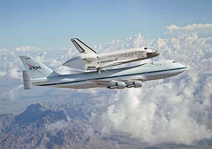Space shuttle Discovery rides piggyback atop a specially modified Boeing 747 on its ferry flight from California to the Kennedy Space Center in Florida
