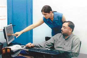 ROUTE TO SUCCESS: Dilpreet Sadana and his sister Manpreet Kaur working on the truckkhoj.com software.
