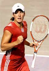 Justine Henin-Hardenne of Belgium celebrates winning a point against Amelie Mauresmo of France 