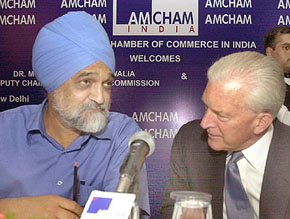 The Deputy Chairman Planning Commission, Dr Montek Singh Ahluwalia (right), and the US Ambassador to India, Mr David Mulford, address a meeting organised by Amcham in New Delhi on Monday.