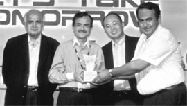 Mr Madhu Sudan Vij (extreme right), CEO, Modern Automobiles Group, receives the Maruti Award for Excellence from Mr Jagdish Khattar, Managing Director, Maruti Udyog Limited, at Hilton hotel in Paris. Also seen in the picture are Mr K. Saito, Director (Marketing and Sales) and Mr K. Kumar, Adviser (Engineering), MUL