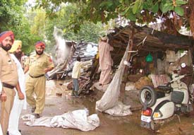 A shanty being demolished by MC staff in Industrial Area-A in Ludhiana on Monday.