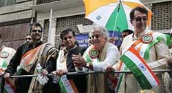 Federation of Indian American president Sudhir Parikh along with Bollywood personalities Anil Kapoor, Shashi Kapoor and Randhir Kapoor, reviews the 25th India Day Parade held in New York