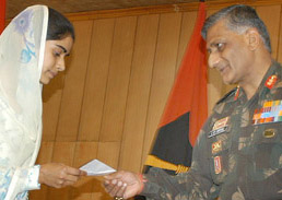 The Chief of Staff, 15 Corps, Major-Gen V.K. Singh, presents scholarship cheques for Rs 25,000 each to five Kashmiri orphan girls on behalf of Uttaranchal Governor Sudarshan Agarwal for pursuing higher education in Srinagar on Tuesday.
