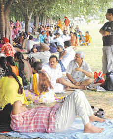 Parents and students wait on the lawns of Panjab University Law Auditorium on Wednesday for the second phase of the B.Ed counselling. 