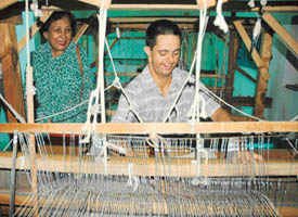 Ms Jean Rodrigues, wife of Punjab Governor and UT Administrator, watches a young member of the Vocational Centre for Mentally Challenged, Sector 11, Chandigarh, work on the loom during her visit to the centre on Tuesday