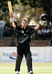 New Zealand's Lou Vincent celebrates on reaching his century against Zimbabwe 