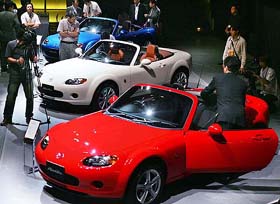 New models of Japanese automaker Mazda Motor Corp.'s popular Roadster, known as the MX-5 in overseas markets, are shown to the media in Tokyo on Thursday