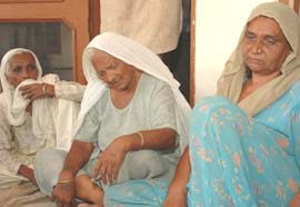 Widow of Koora Ram (extreme right) who was found murdered, being consoled by relatives at Saneta village on the Landran-Banur road on Thursday.