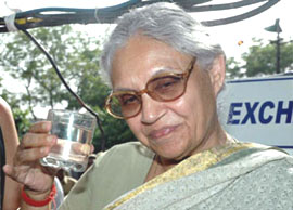 Chief Minister Sheila Dikshit tastes the water treated by INDION MBR technology at Sewage Treatment Plant, Okhla in the Capital on Thursday.