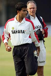 Indian captain Saurav Ganguly talks to coach Greg Chappell during a practice session at Bulawayo's Queens Sports Club on Thursday