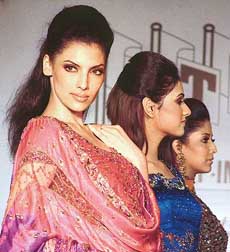 Indian and Pakistani models display the designs of Umesh Vashisht in New Delhi on Friday.