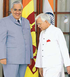 Foreign Minister of Sri Lanka Anura Bandaranaike and External Affairs Minister K. Natwar Singh prior to attending a meeting at Hyderabad House in New Delhi on Friday.