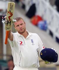 Englands Andrew Flintoff raises his bat on completing his century on the second day of the fourth Ashes Test against Australia at Trent Bridge in Nottingham on Friday