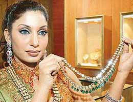 Pakistani actress Nirma displays a necklace at the inauguration of the Bride and groom, jewellery and watch exhibition, 2005, in New Delhi on Saturday. Over 150 exhibitors from India and Pakistan are participating in the trade-cum- consumer exhibition, which ends on August 29.