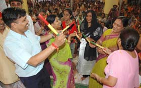 Devotees playing dandiya on the occasion of Janmashtami at Birla Temple in the Capital