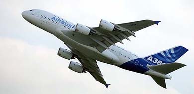An Airbus A380, the world's largest passenger plane, flies over the Airbus plant in Hamburg 