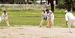 A cricket match between Municipal Corporation Club and Unique Cricket Club in progress at Satish Chander Dhawan Government College for Boys in Ludhiana on Sunday. 