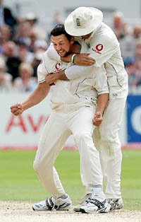 Englands Steve Harmison (left) and Michael Vaughan celebrate the dismissal of Australias Simon Katich on the fourth day of the fourth Test of the Ashes series at Trent Bridge in Nottingham on Sunday.
