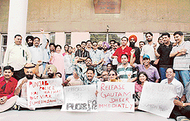 Journalists hold a rally outside the DCs office against the arrest of Indian Express journalist Gautam Dheer on Sunday night.