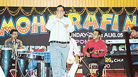 One of the amateur singers presents a song during the show Ek Sham Rafi Kay Naam.