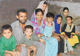 Dilshad and Saira Bano with their seven (now eight) children as they brought home an abandoned girl (in Sairas lap) in Ludhiana on Tuesday