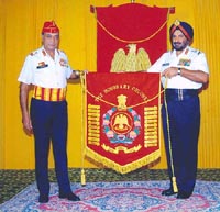 The Army Chief, Gen J.J. Singh, receives the banner of Honorary Colonel of the Regiment of Guards from Lieut-Gen R.B. Singh in New Delhi on Tuesday