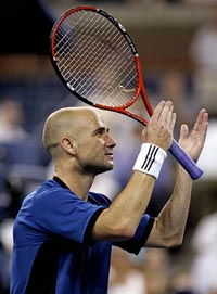 Andre Agassi of the USA thanks the crowd after defeating Razvan Sabau of Romania in his first round match of the US Open at Flushing Meadows in New York on Monday. 