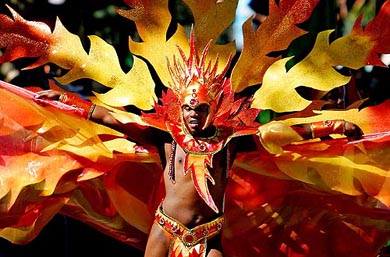 A carnival-goer dances at the annual Notting Hill Carnival in London