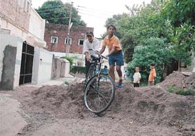 Mounds of construction material lying outside the entrance of houses in Sector 30-B, Chandigarh