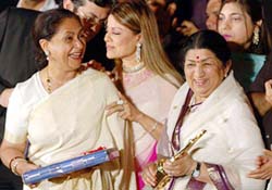 Melody queen Lata Mangeshkar after receiving the Legend Honour 2005 trophy from veteran actress and MP Jaya Bachchan during an exclusive felicitation ceremony at the Sahara One Sangeet Awards 2005, in Mumbai on Tuesday.
