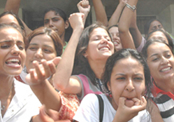 Girls raise slogans and blow whistles in support of their presidential candidate Jasmine Dhaliwal (independent) during an open house at the Government College for Girls, Sector 11, in Chandigarh on Thursday.