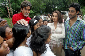Bollywood stars Amitabh Bachchan, Rani Mukherjee and Abhishek Bachchan interact with orphans from tsunami-affected Andaman and Nicobar islands, in Mumbai