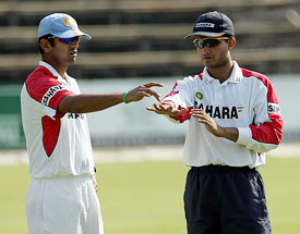 Sourav Ganguly talks to Rahul Dravid during a practice session at the Harare Sports Club on Thursday