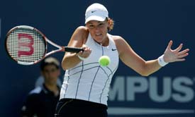 Lindsay Davenport of the USA hits a return shot to Pauline Parmentier of France during their second-round match at the US Open in New York on Thursday