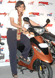 TVS Motors Company Brand Manager Anuradha Bambawale poses with TVS Scooty during a product launch in New Delhi. 