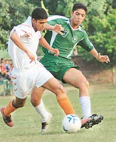 A match between CFA, Chandigarh, and Gurdaspur Football Academy in progress at Sector 42 Stadium