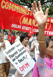 Activists of the CPM raise slogans during a demonstration to protest against the attack on Dalits in Haryana